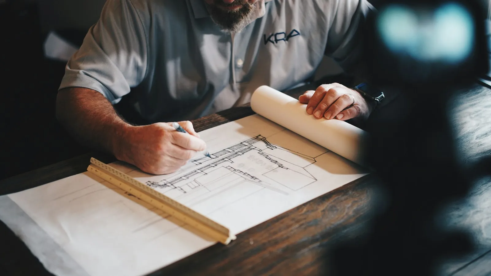 Estimator reviewing plans instead of retyping subcontractor bids into Excel